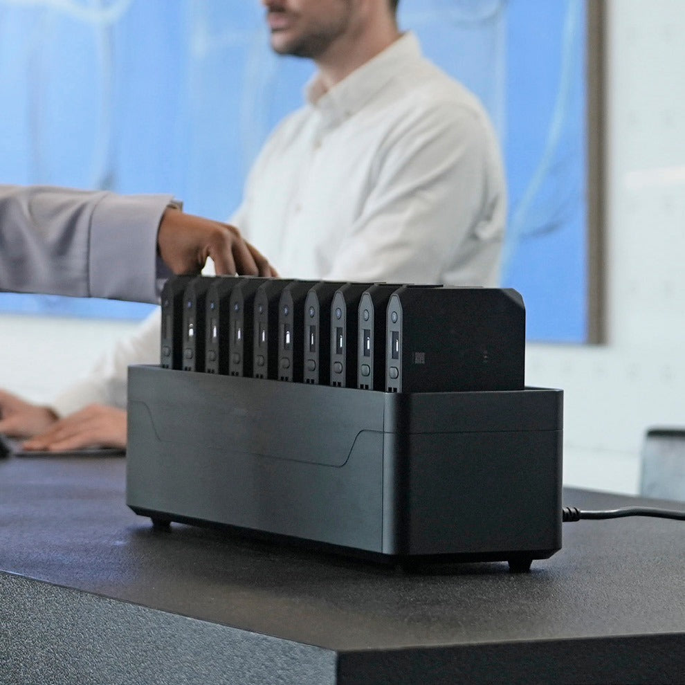 Taking a power bank from an Omni Power Station in a meeting room
