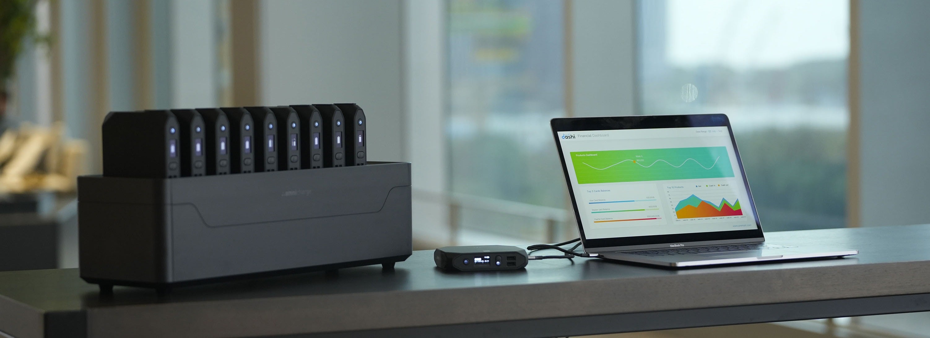 Omni Power Station 20+ next to a laptop