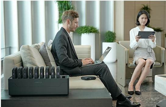 Guests working from a lounge with a Power Station