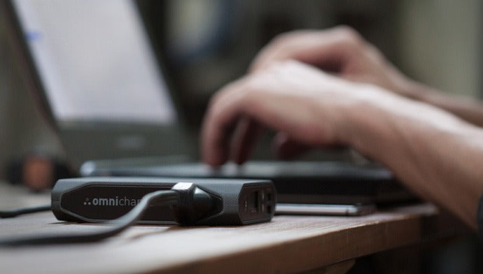Omni 20+ next to a laptop