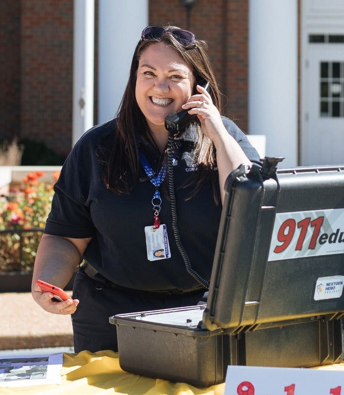 Instructor on the phone with the 911 training unit