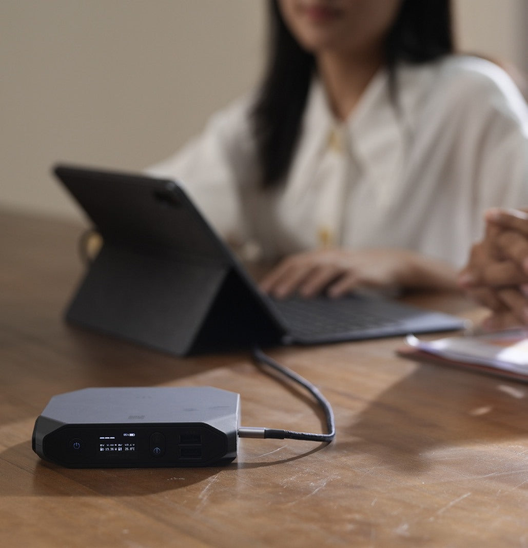 Working on a tablet powered by an Omni power bank