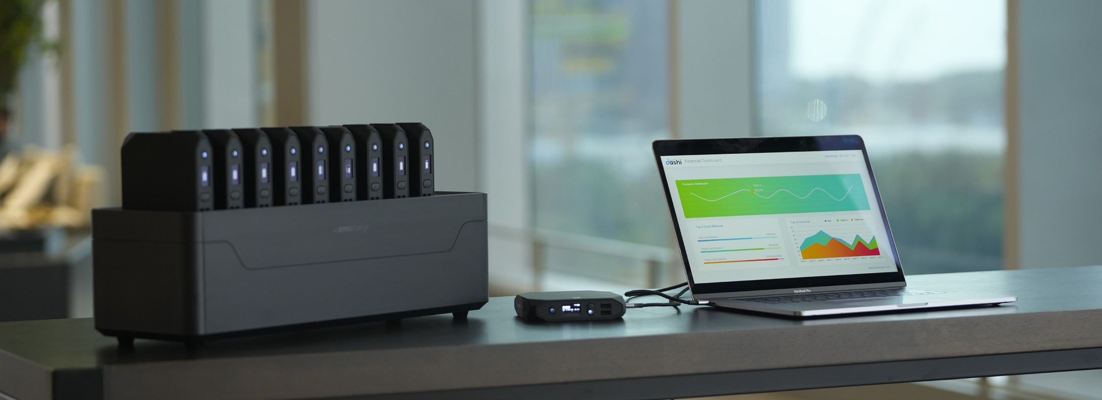 Omni Power Station and laptop on a desk